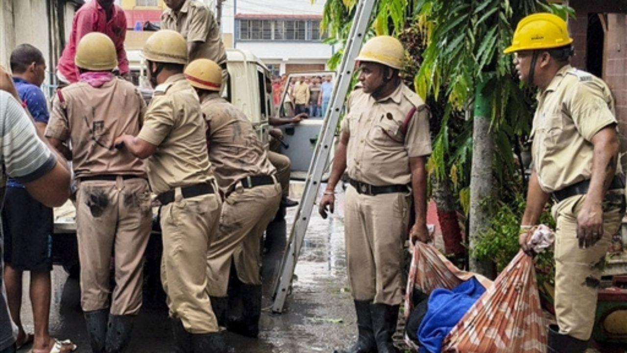 Rescue personnel carry out operations after a fire broke out at a private hotel in Tarapith, in Birbhum district, West Bengal. Pic/PTI
